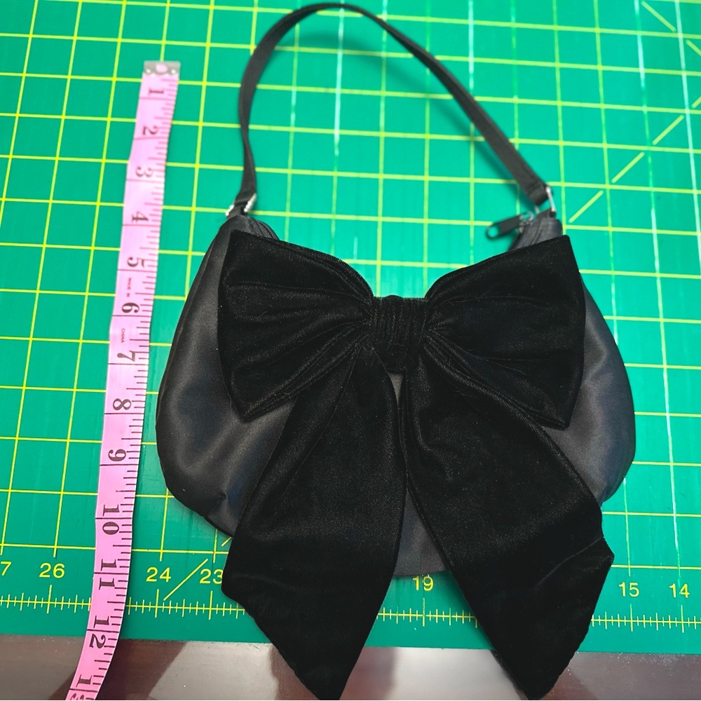 Cute little black evening bag with velvet bow